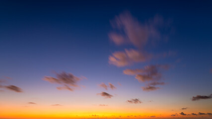 Obraz premium Sky with clouds during sunset. Clouds and blue sky. A high-resolution photograph. Panoramic photo for design and background.