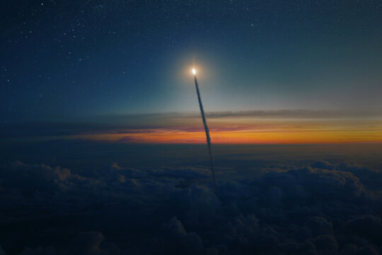Space rocket shuttle with blast and smoke flies through clouds into starry space at sunset. Spacecraft successfully takes off from the planet Earth into outer space. Rocket launch, concept
