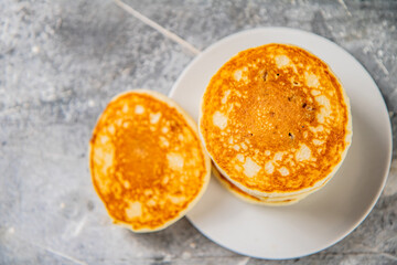 Pancakes in a plate on the table. 