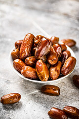 Full bowl with dates on the table. 