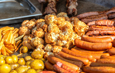 Barbecue sausage and vegetables in a big frying pan