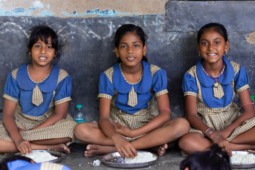 Students having mid day meal at school
