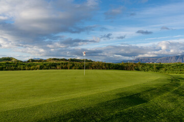 View of Golfclub Seltjarnarnes close to Reyjkjavik in Iceland and mountains in the background