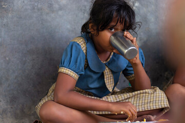 girl Student having mid day meal at school