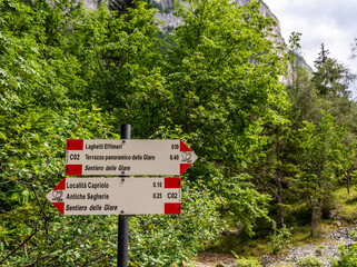 hiking trails wooden signs in Mountains - Trentino Alto Adige,Italy - Juli 2, 2021