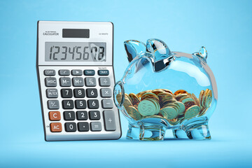 Piggy bank with coins and calculator. Savings, investment and accounting business concept.