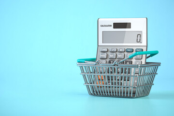 Calculator in shopping basket. Home budget, savings, inflation and consumerism concept