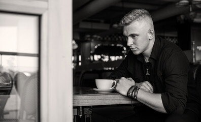 Young man in sadness or depression, grief and bad mood. Psychology problems among guys. Image sad guy thinking about something