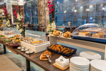 Restaurant interior with food buffet table