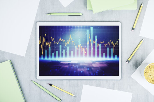 Digital tablet with abstract financial graph, finance and trading concept. Top view. 3D Rendering