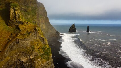 Drone view of Icelandic nature. Black sand beach
