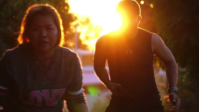 They were having fun playing pickleball at sunset