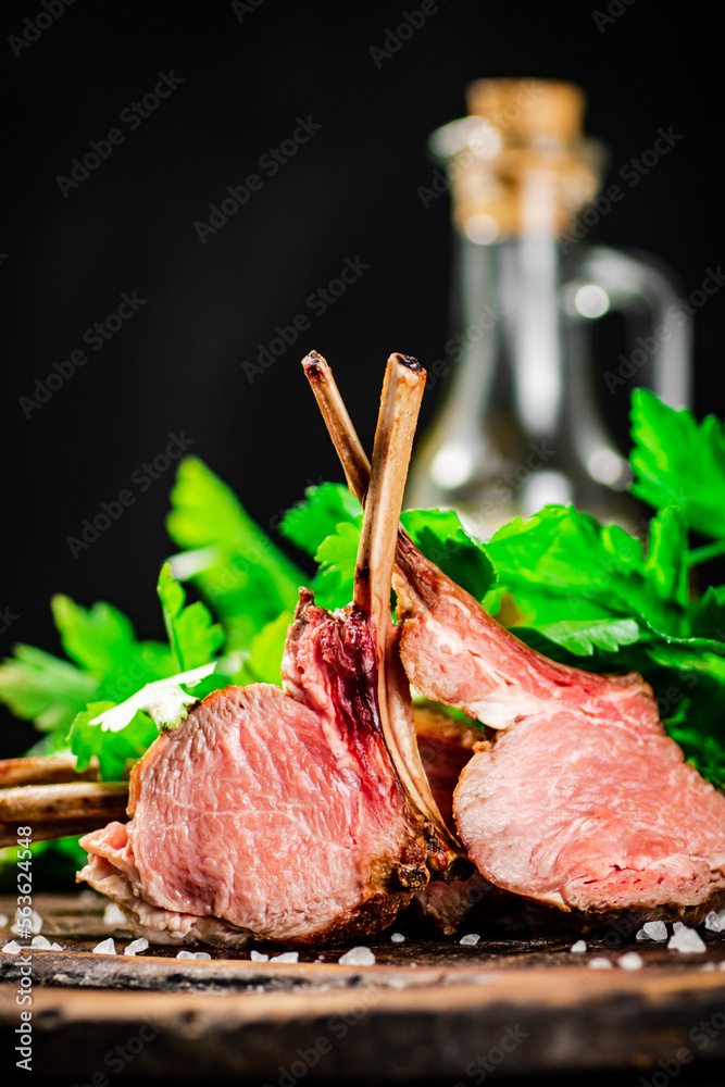 Poster Rack of lamb grill on a cutting board. 