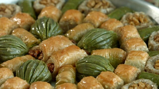 Traditional turkish baklava pistachio pastry. Dilberdudagi, ozel kesim baklava, cikolatali baklava, fistikli baklava, katmer, fistikli kadayif, kattafi, fistik sarma, soguk baklava, midye baklava, cev