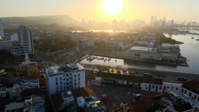 Aerial shot drone flies over Plaza de la Aduana toward boat marina and muelle de los pegasos