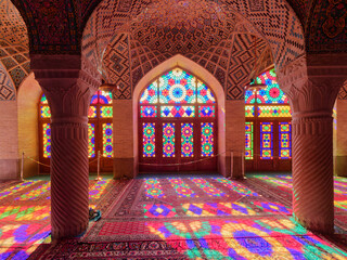 Fototapeta na wymiar Windows of the colorful Nasir Al Mulk Mosque (known as the Pink Mosque) in Shiraz, Iran