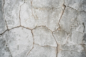close up texture of cracked plaster on old house wall
