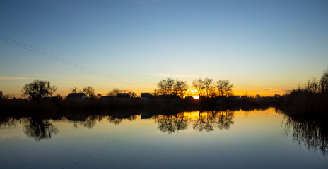 sunset and the smooth surface of the river