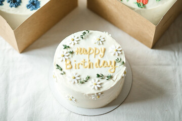 Birthday white color cake with happy birthday lettering