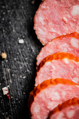 Cut into round pieces of salami sausage. 