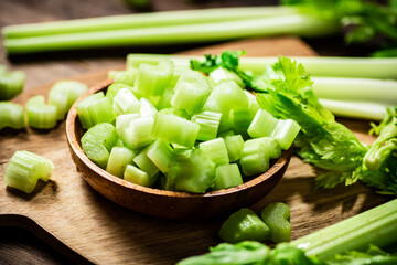 Sliced fresh celery on a cutting board. 