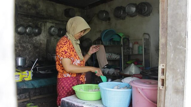Portrait of Asian Woman Preparing Food in the Kitchen