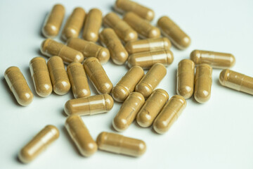 Ashwagandha capsules on a white background, tablets supporting immunity, supplementation of the...