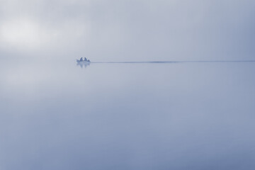 Fishing Boat in Misty Water — Minimalist Horizontal Scene with Motion Blur and Silhouetted Fishermen