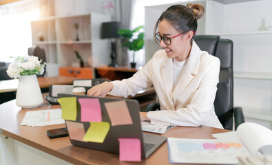 happy business beautiful asian woman work. glasses female worker busy with online group meeting but...
