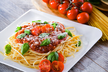 Composition with a plate of spaghetti bolognese