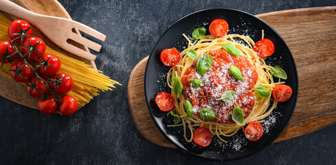 Composition with a plate of spaghetti bolognese