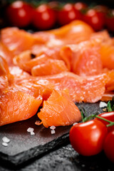 Fragrant salted salmon on a stone board. 