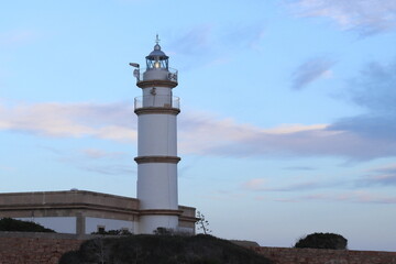Naklejka premium Faro de cabo de ses Salines. Santayí.