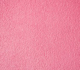 Pink coloured decorative plastered wall.