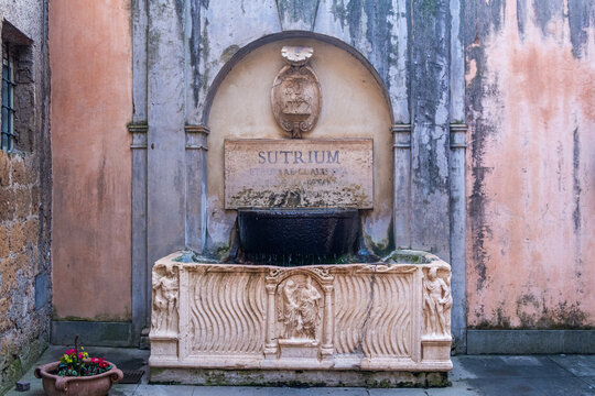 The ancient sarcophagus used as fountain in the town square of Sutri. Sutri, Viterbo, Lazio, Italy, Europe.
