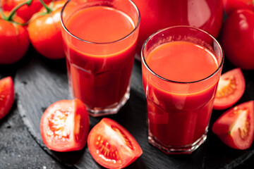 Tomato juice on a stone board. 