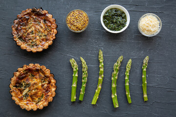 Traditional vegetable tart quiche with asparagus and cheese, top view. 