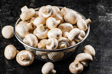 Fresh mushrooms in a colander. 