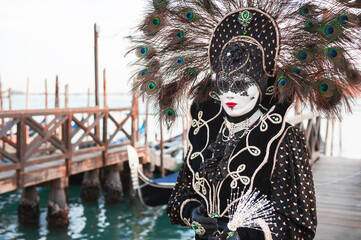 Fototapeta na wymiar Beautiful colorful masks at traditional Venice Carnival in Venice, Italy