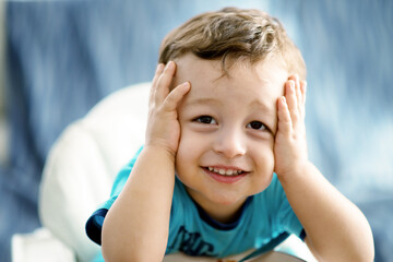 Child showing funny expression worried and unbeliaving

