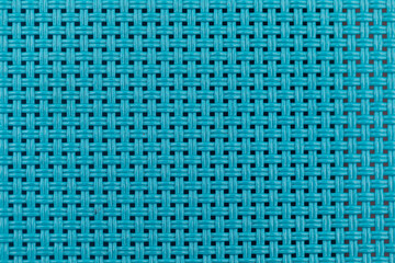 A close-up of turquoise fabric background texture