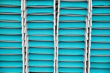 Stacked turqoise lounge chairs