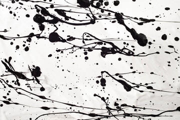 dipping black paint on white background