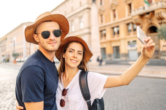Happy Young couple taking selfie portrait with smartphone mobile. Tourism, friendship, youth and weekend activities concept. Close up portrait. Tourism, selfie photos, bloggers. Valentine's Day