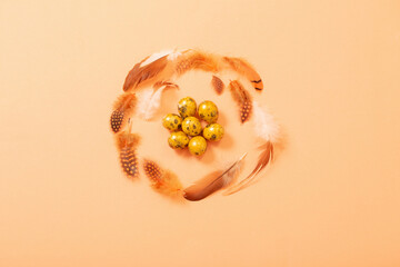 easter golden quail eggs on pastel background