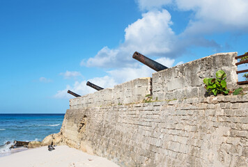 Vintage canons line the ramparts at the Charles Fort in Bridgetown Barbados.
