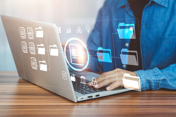 Document management concept, Businessman using computer to document management concept, online documentation database and digital file storage system or software, records keeping, database technology