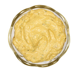 Pineapple curry spread in glass bowl isolated on white, top view