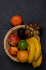 Trough with assorted fruits. Space for text