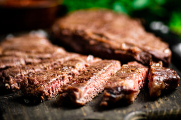 Flavorful grilled steak on a cutting board. 